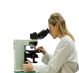 woman looking into microscope